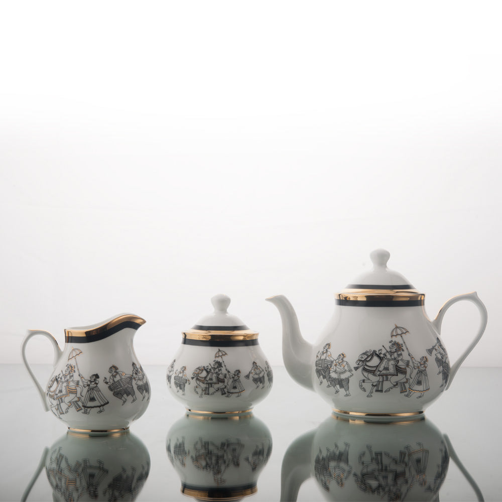 Kaunteya Byah Premium Tea Set- Lightweight, fine bone china, tableware, luxury tea set, 18 pieces, 24K gold plated, Phad art, beautiful white, black and gold crockery with intricate black and gold wedding design.