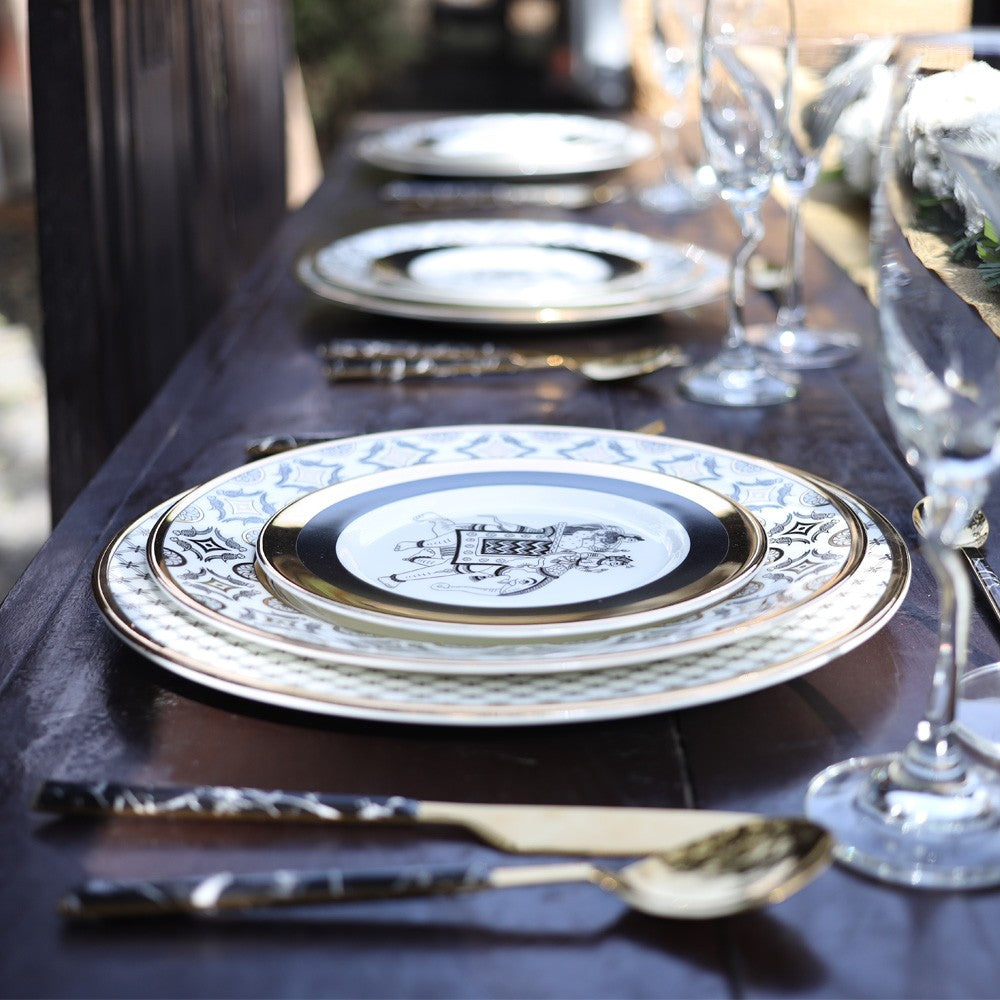 Kaunteya Byah Premium Charger Plate- Lightweight, fine bone china, tableware, luxury charger plate, 24K gold plated, Phad art, beautiful white, black and gold crockery with intricate black and gold wedding design.