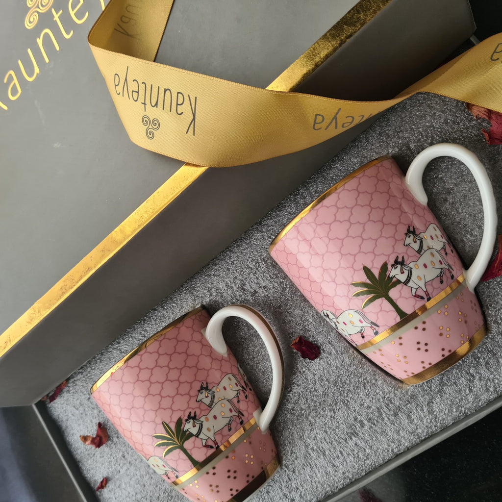 Kaunteya Pichwai Premium Gift Set- Lightweight, fine bone china, tableware, luxury 2 pink coffee mugs, gift box, 24K gold plated, beautiful pink and gold crockery with intricately designed cows.