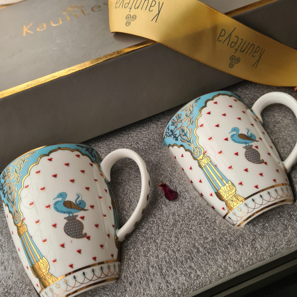Kaunteya Dasara Premium Gift Set- Lightweight, fine bone china, tableware, 2 coffee mugs with a gift box, 24K gold plated, beautiful blue and white crockery with royal blue and gold birds and pillars design.