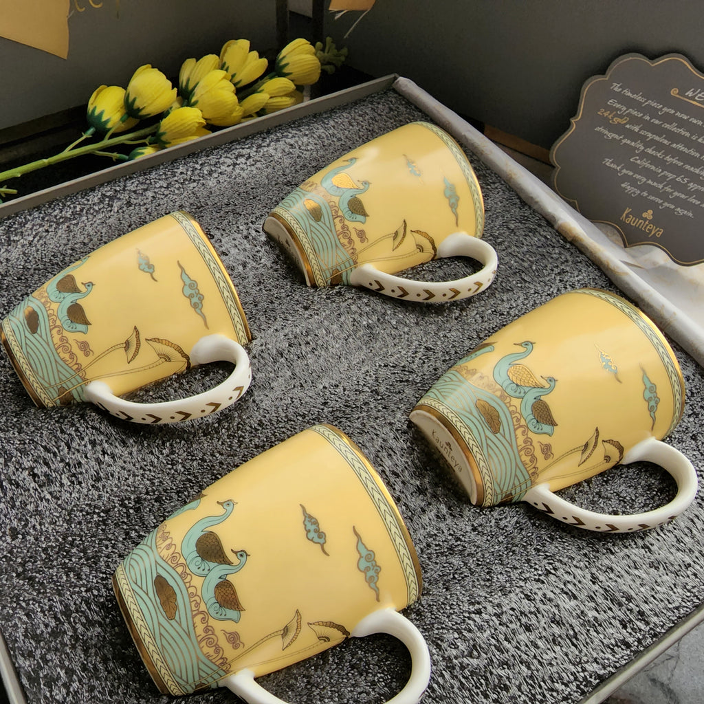 Kaunteya Airavata Premium Gift Set- Lightweight, fine bone china, tableware, luxury 4 yellow coffee mugs with a gift box, 24K gold plated, Pattachitra art, beautiful yellow and gold crockery with intricately designed green swans.
